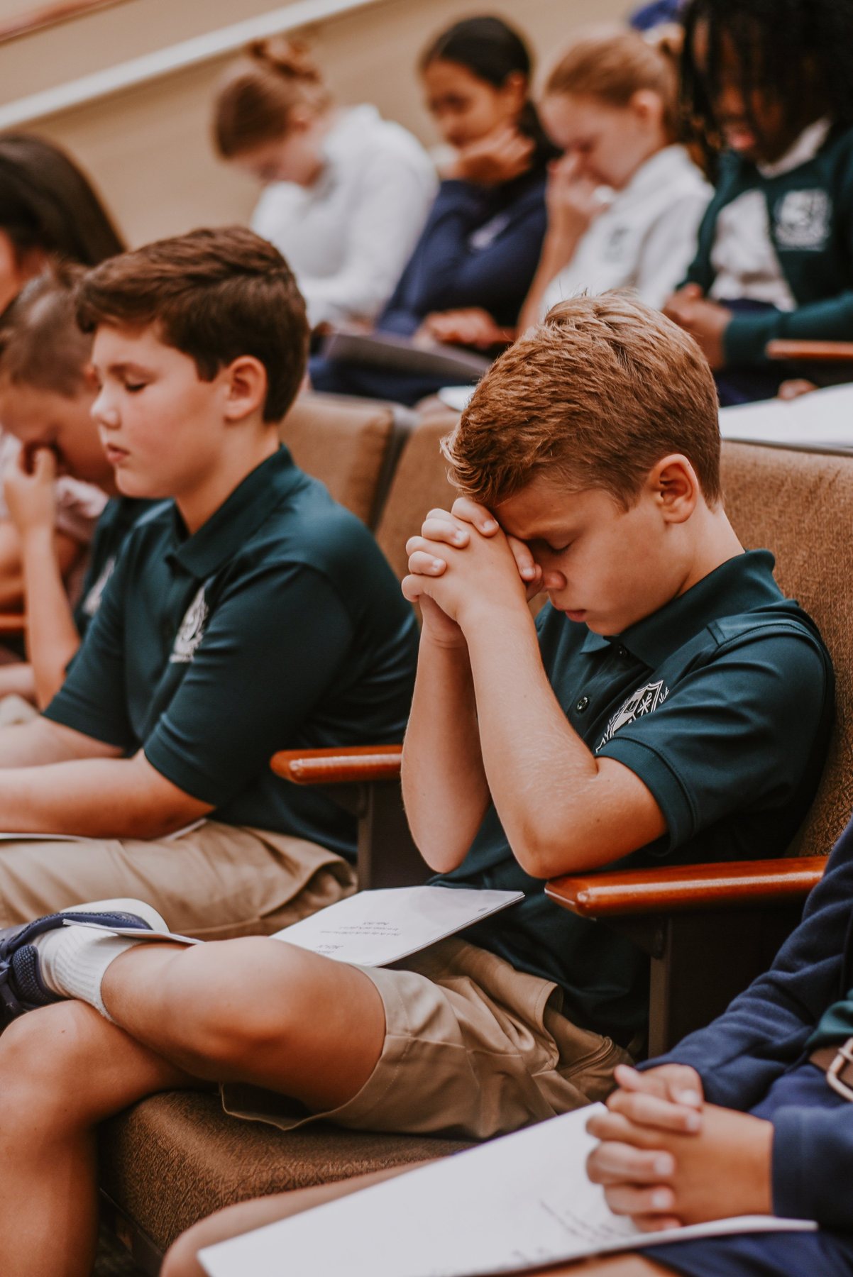 Evergreen students sharing a quiet moment of prayer